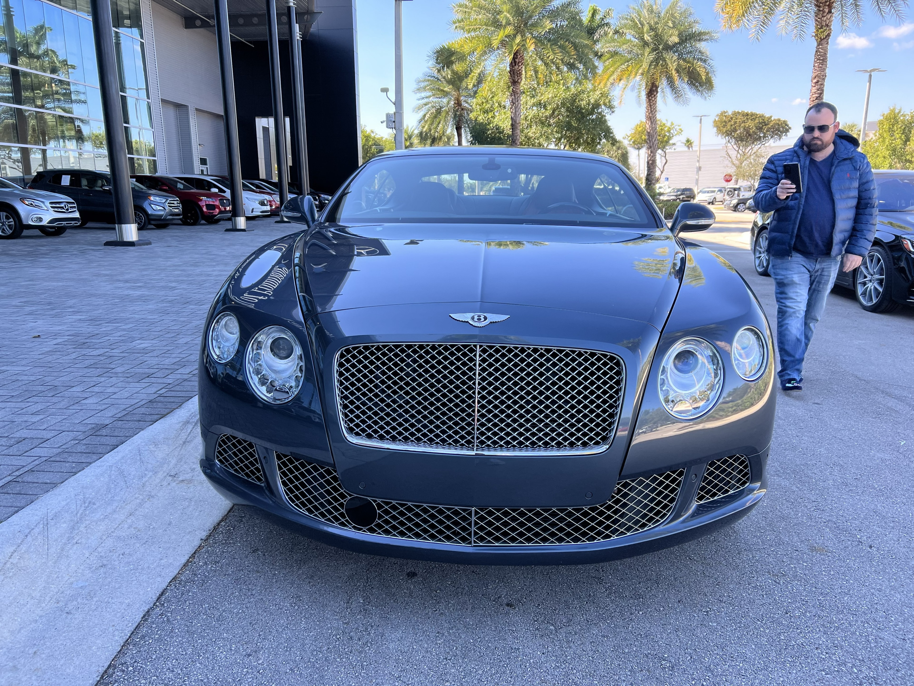 Dark blue Bentley Continental GT at dealership